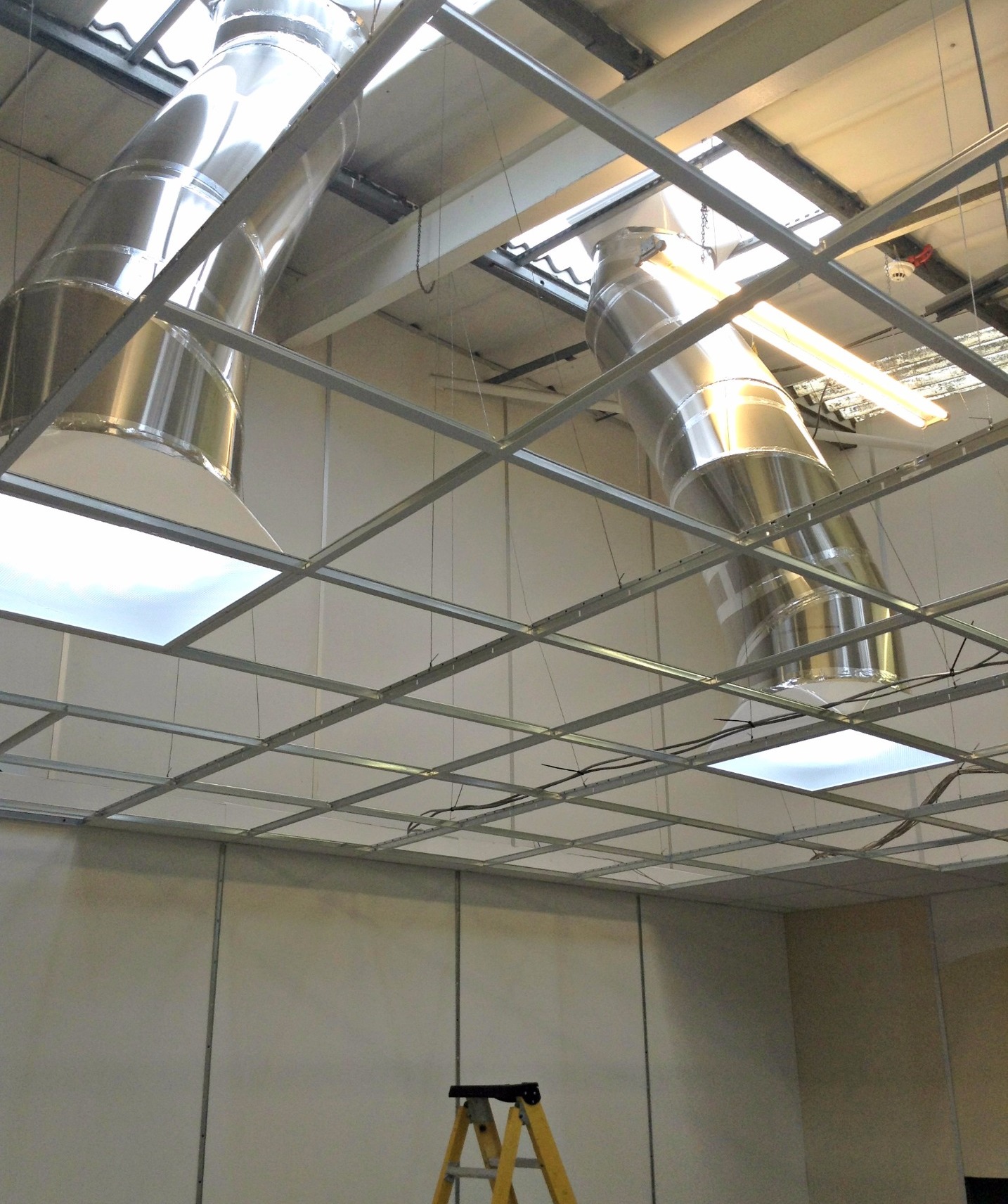 2 daylighting systems installed up to glass in suspended ceiling