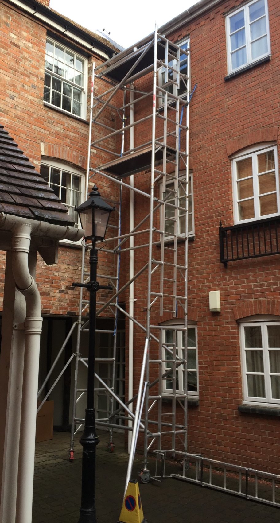 Safety scaffolding outside residential building for installer to use